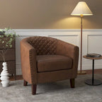 Sillón moderno de polipiel con ribete de tachuelas y giratorio