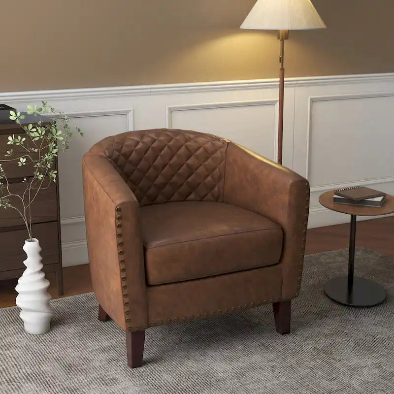 Sillón moderno de polipiel con ribete de tachuelas y giratorio