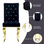 Sillas de comedor tapizadas con botones negros y patas doradas